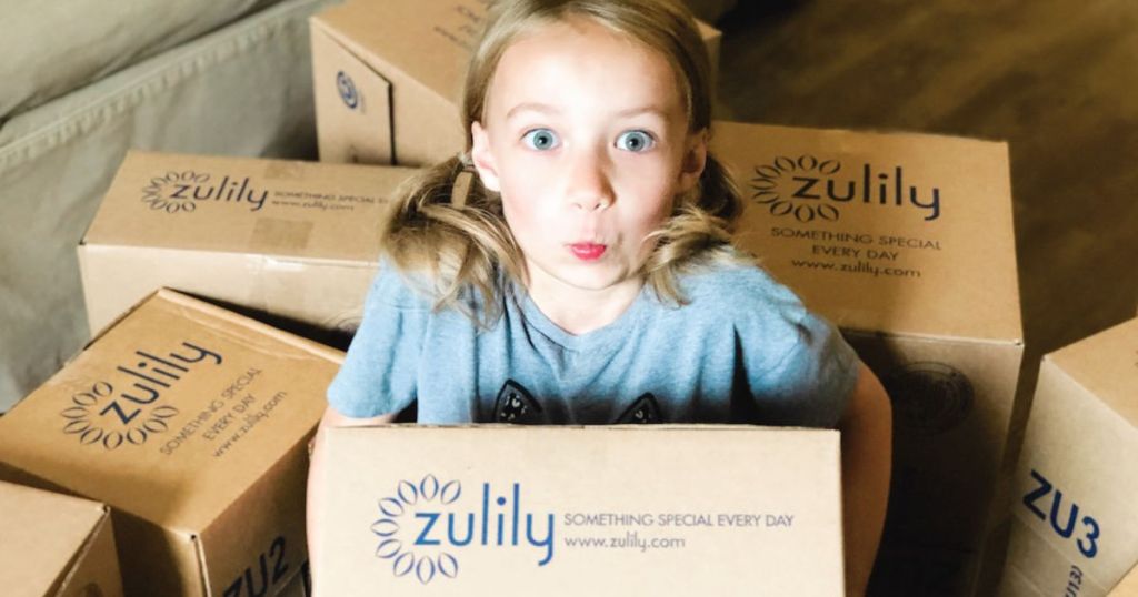 girl holding up zulily box