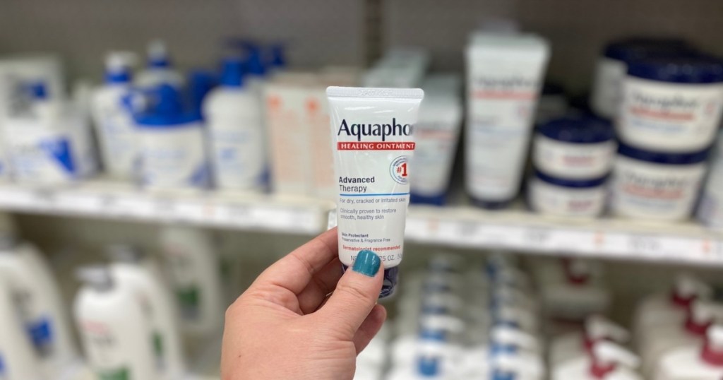 hand holding tube of Aquaphor