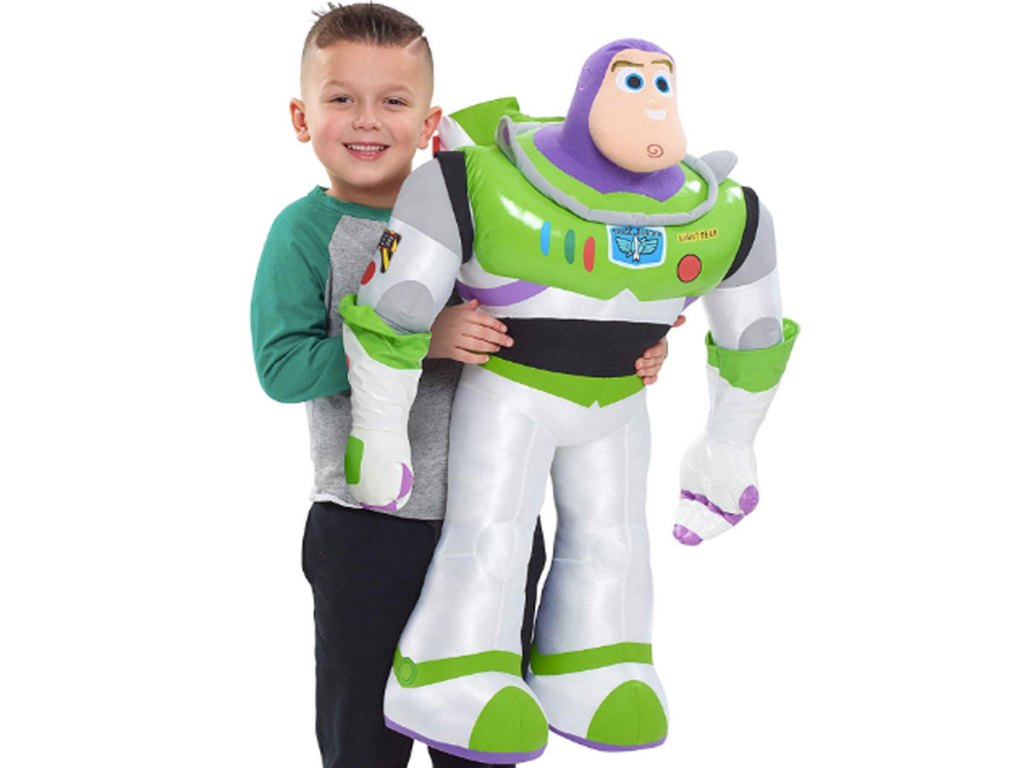 boy holding gigantic disney toy story 4 buzz lightyear plush