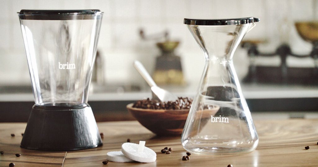 brim cold brew coffee maker on table with coffee in background