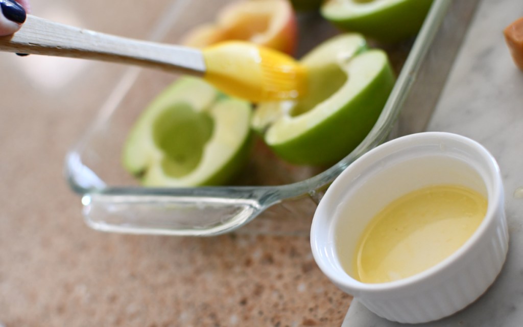 brushing apples with melted butter