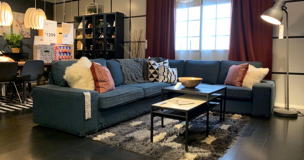 blue couch on showroom living room floor IKEA