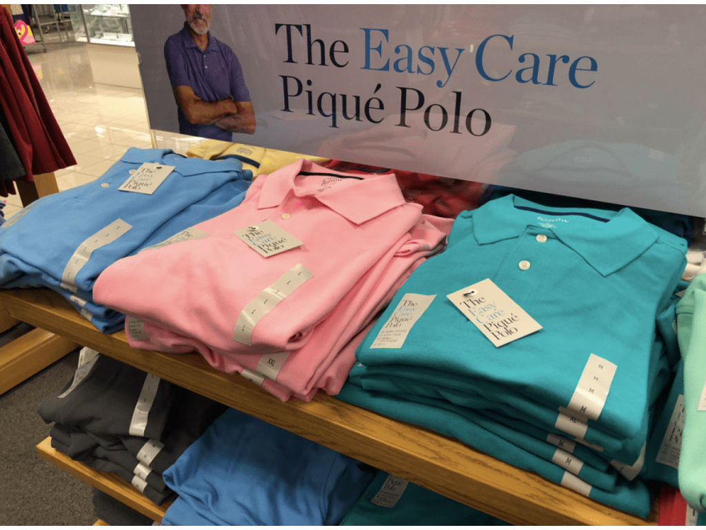 easy care pique polos on store display