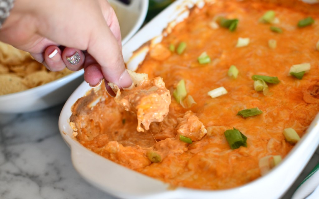 dipping into buffalo chicken dip