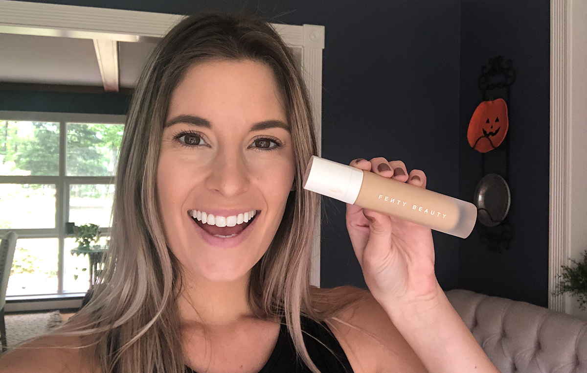 Emily holding up Fenty Pro Filt'r foundation