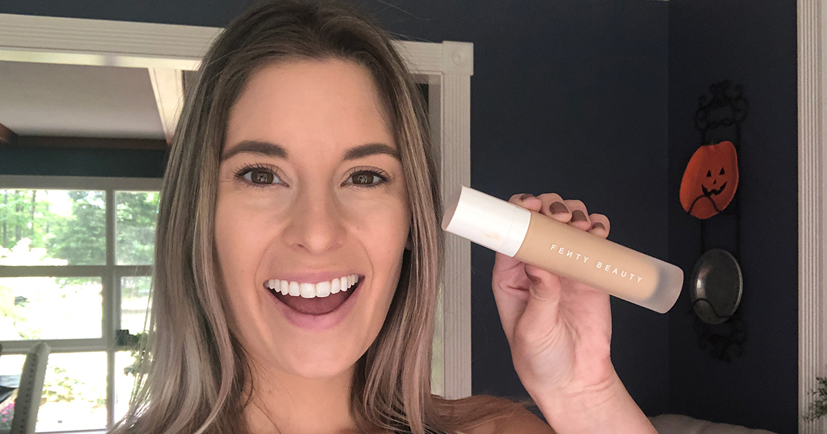 Emily holding up Fenty Pro Filt'r foundation