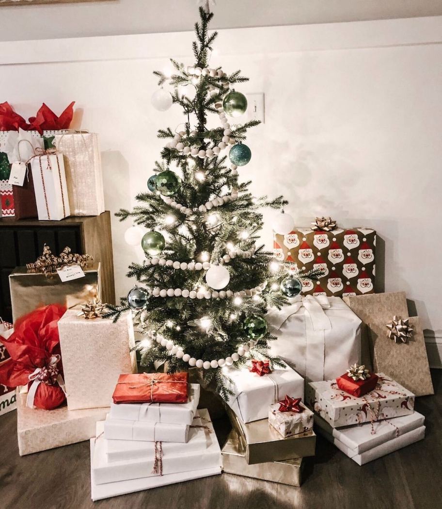 christmas tree with wrapped gifts underneath