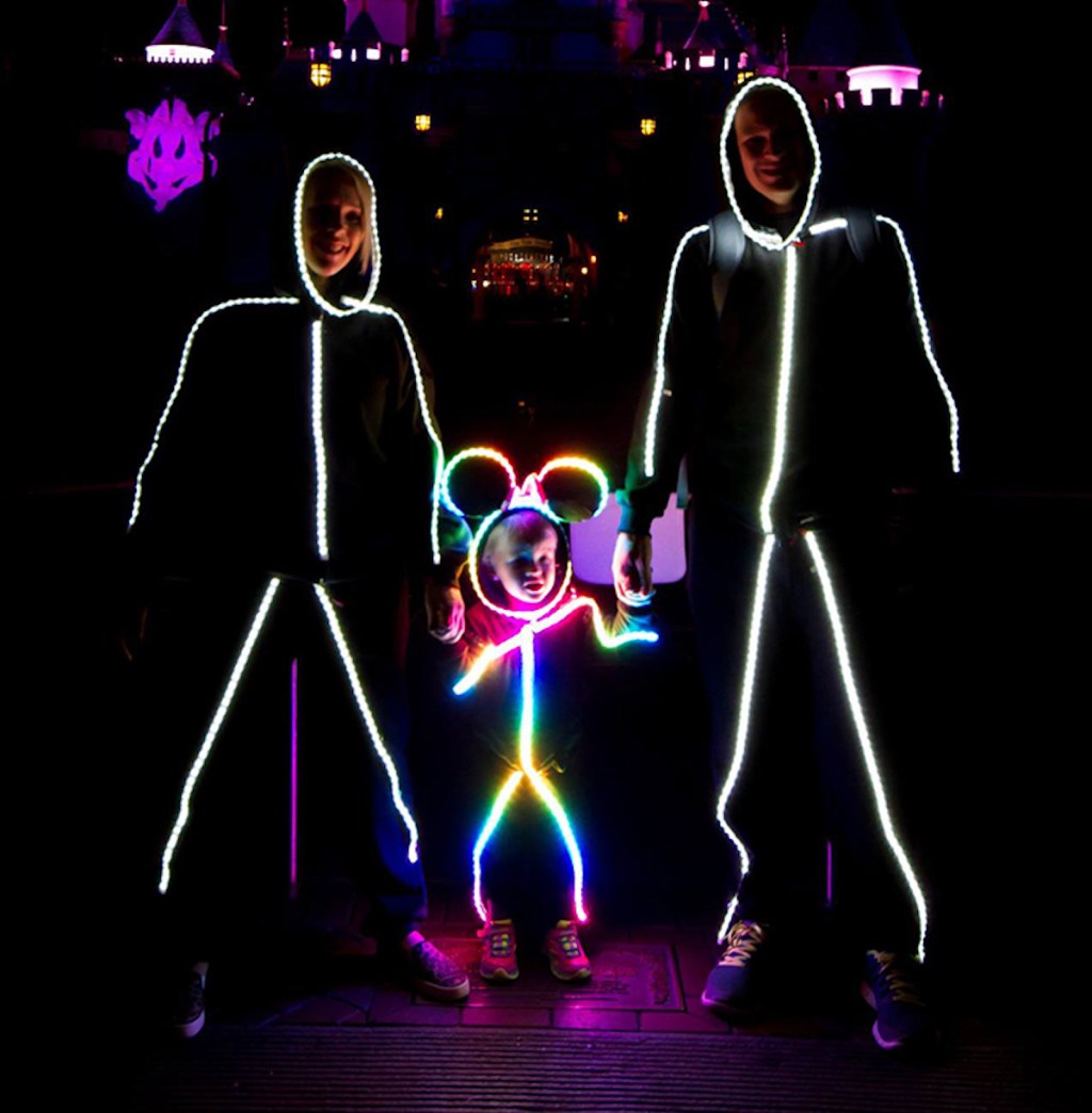 glow stick family wearing costumes