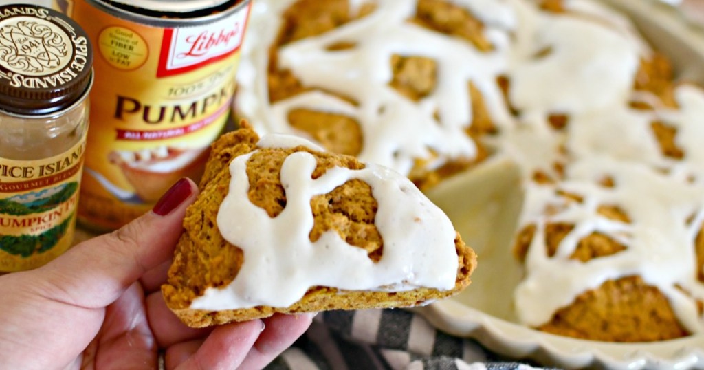 holding a pumpkin spice scones