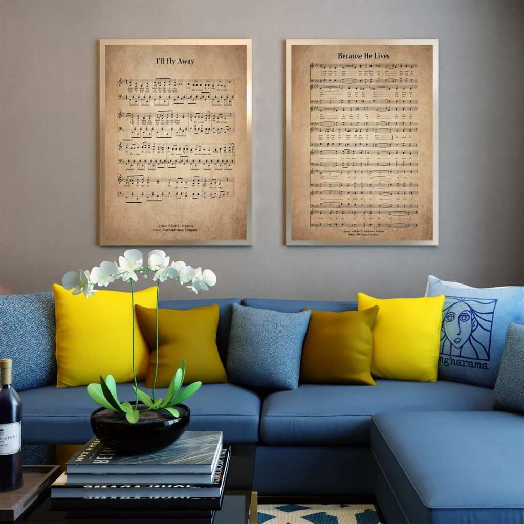 two vintage hymn prints hanging on wall behind couch