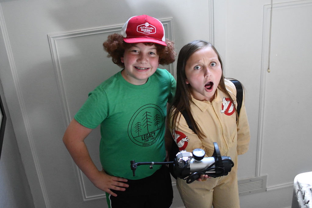 kids wearing Stranger Things Dustin and Ghostbuster Costumes 