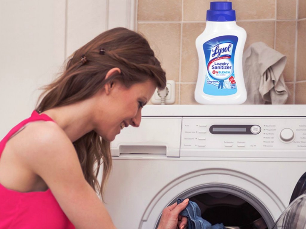 woman doing laundry by washer