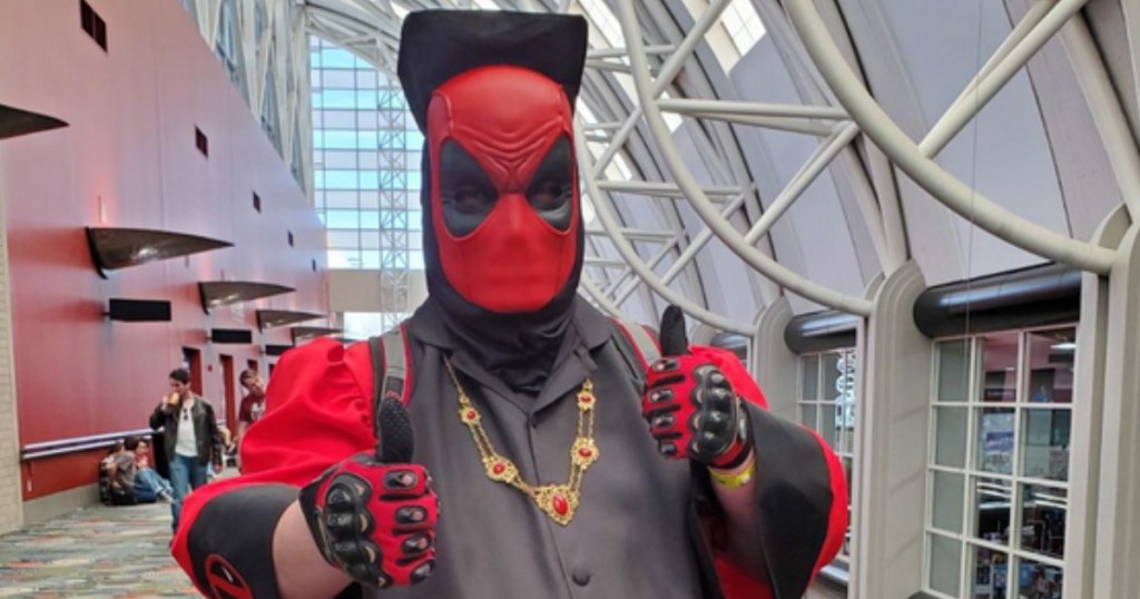 man wearing marvel deadpool mask