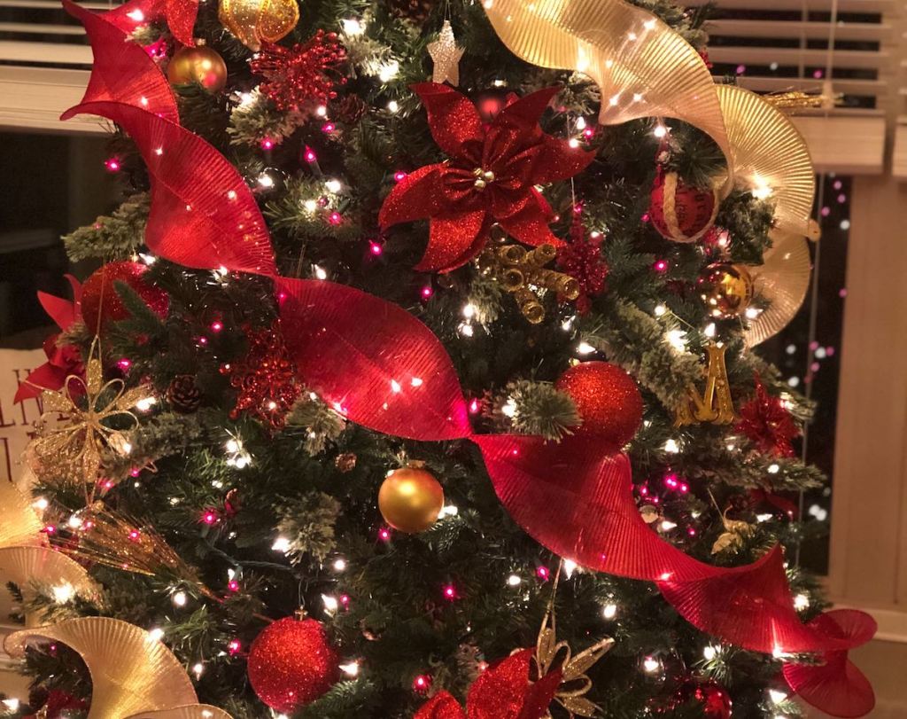 red and gold christmas tree with ornaments