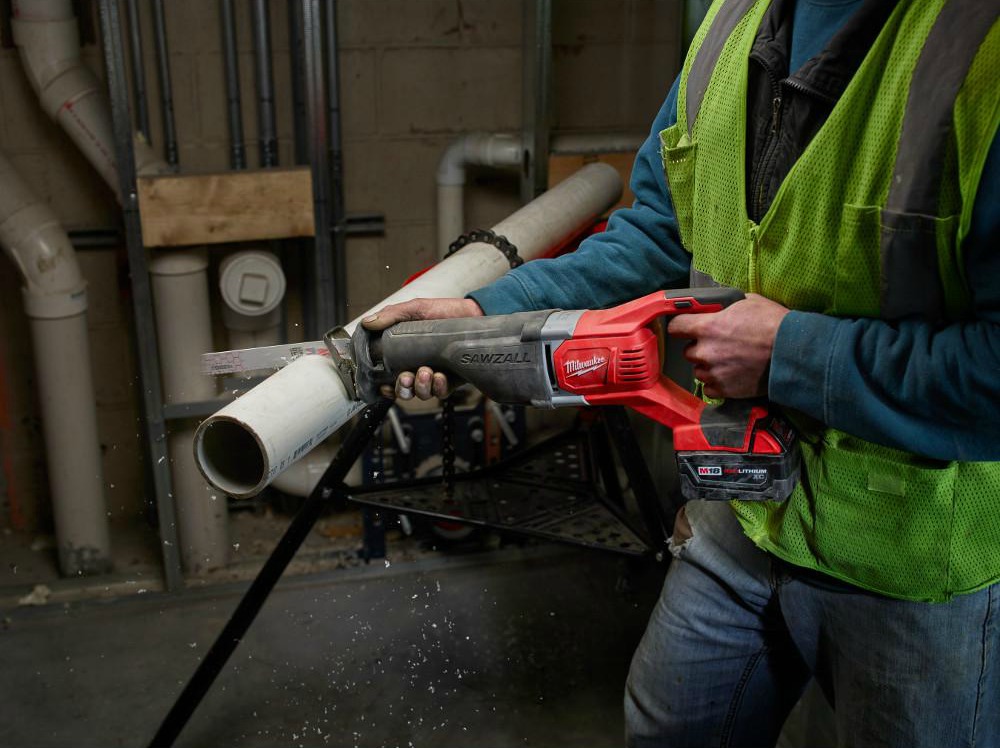 milwaukee Sawzall cutting through pipe