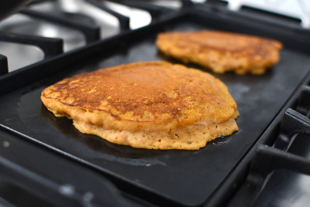 pumpkin pancakes on griddle 