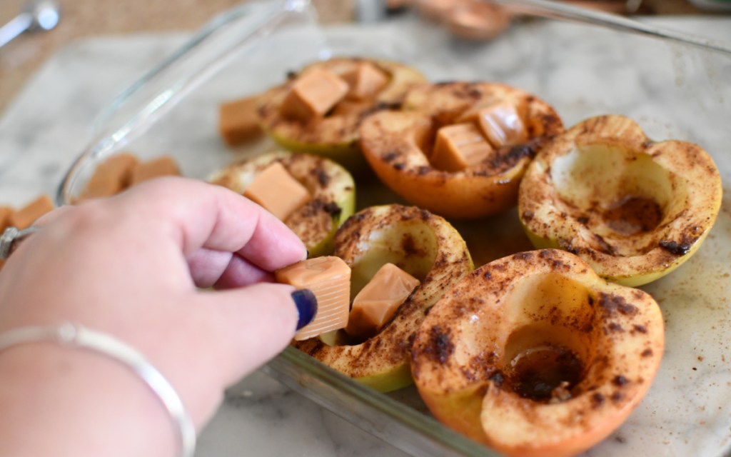 putting caramel in the apples