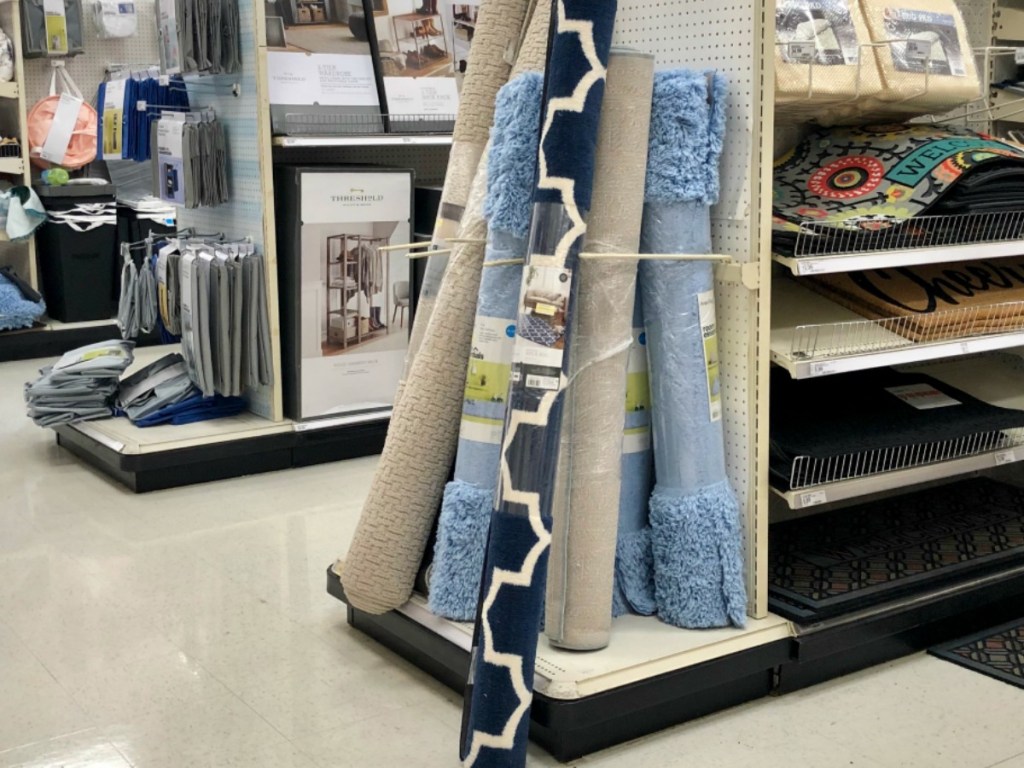 store display of carpets rolled up