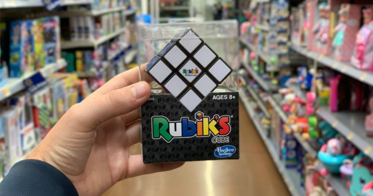 hand holding rubik's cube in store