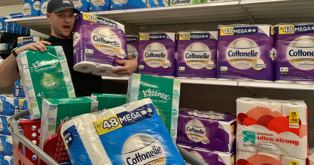 stetson holding Kleenex and Cottonelle in a Target store