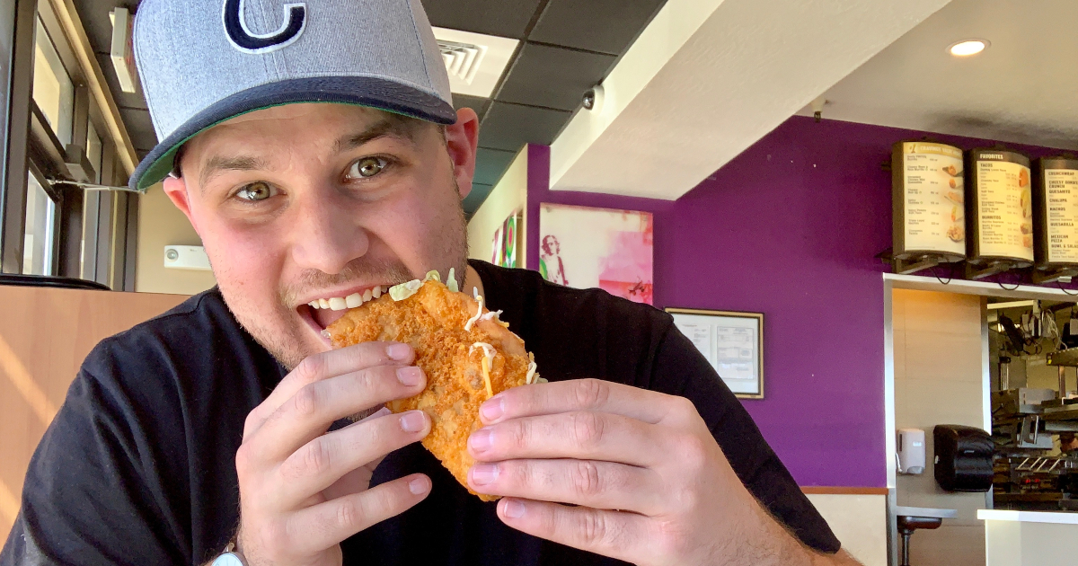 man eating Taco Bell cheddar chalupa