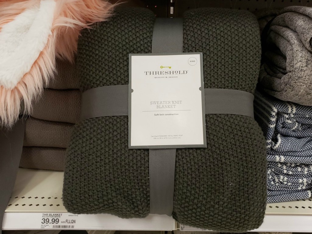 dark green blanket on store shelf