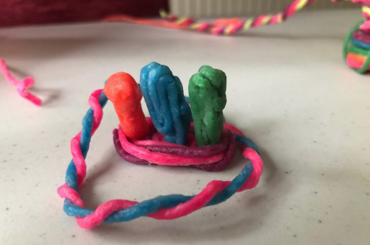 colorful wikkistix string art on table