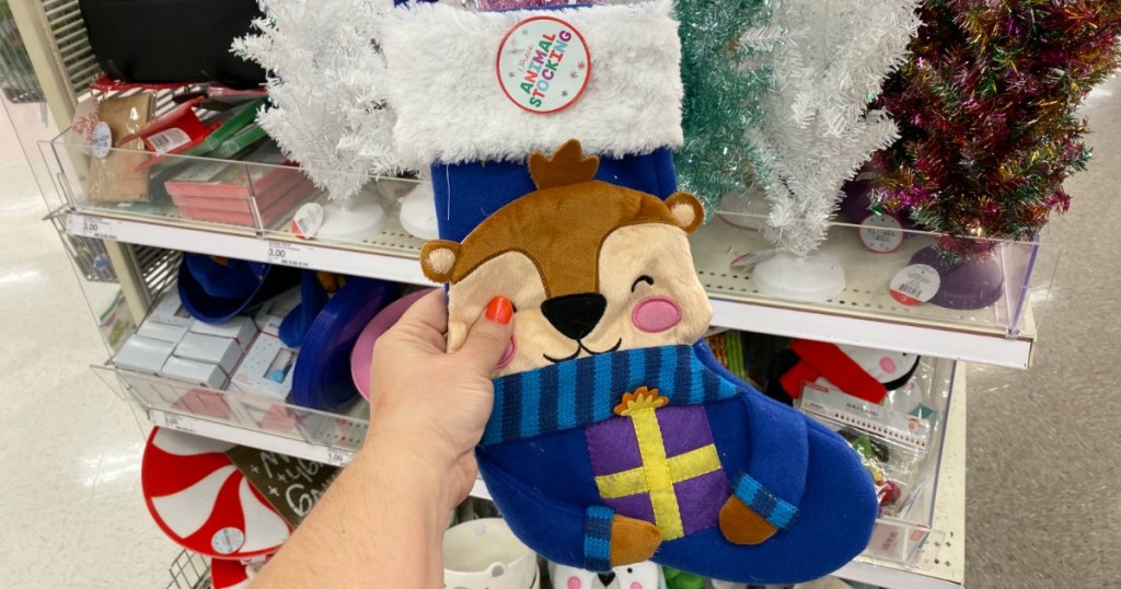 Otter Animal Stocking in hand in front of in-store display in Target