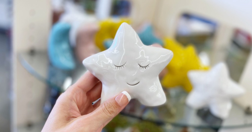 hand holding up ceramic star decor