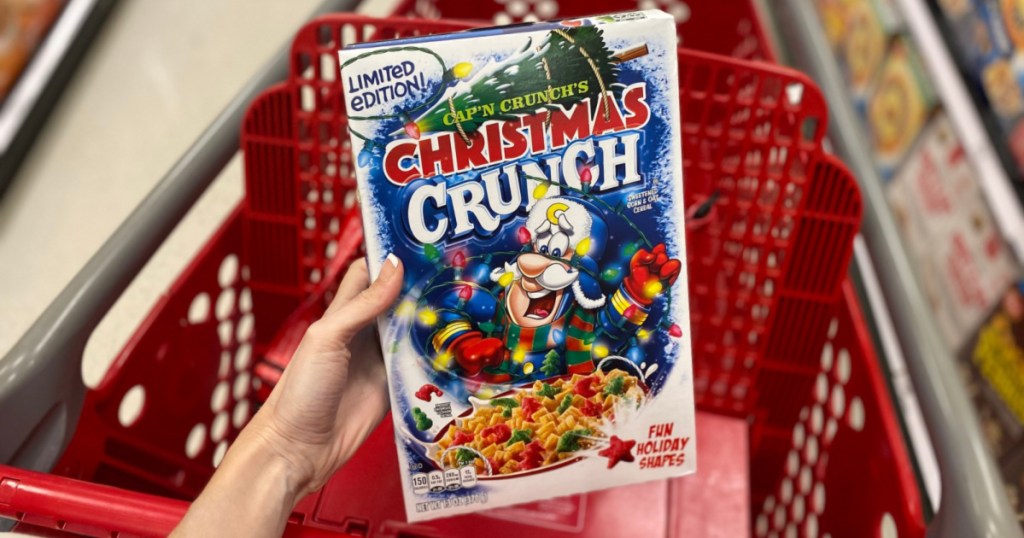 hand holding up box of christmas crunch cereal