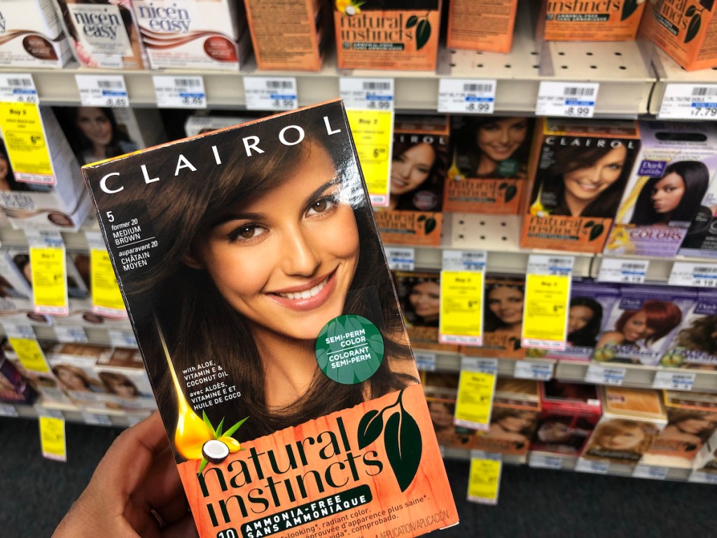 hand holding box of Clairol at CVS