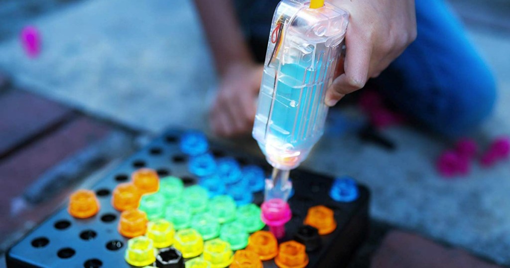 kids using plastic drill on light up board