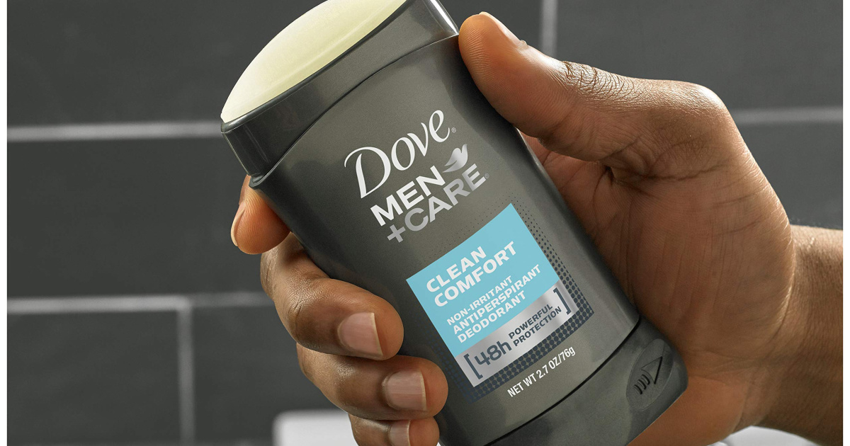 hand holding up dove men + care deodorant stick