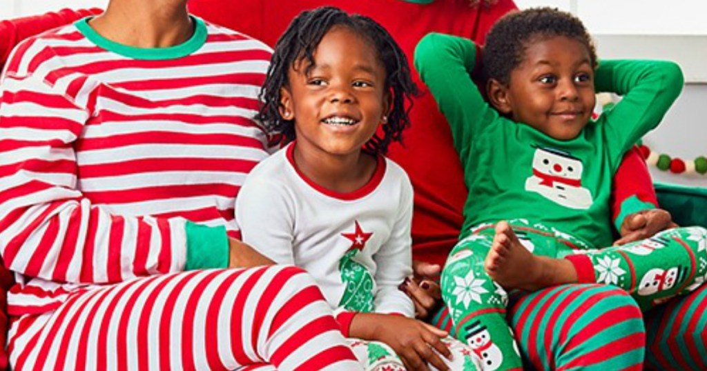 Family wearing Christmas matching PJs