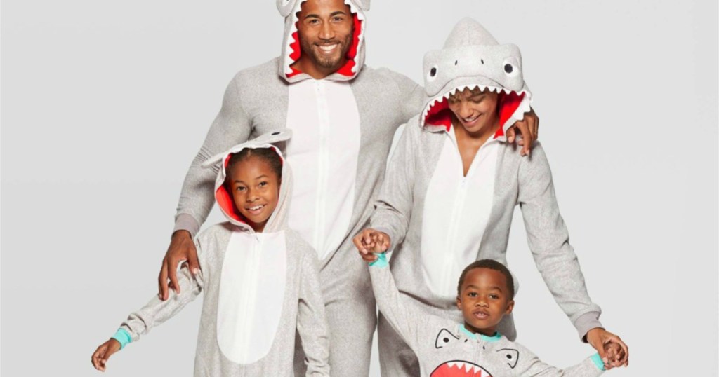 family dressed in matching shark union suits