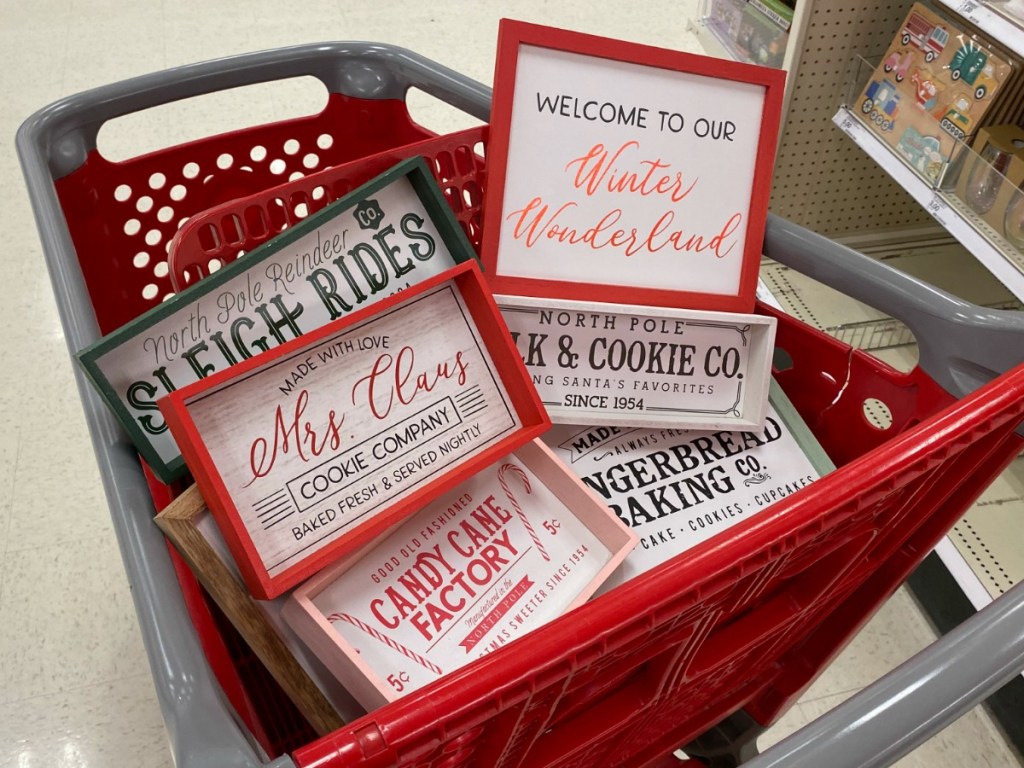 Cart full of Holiday themed signs at Target