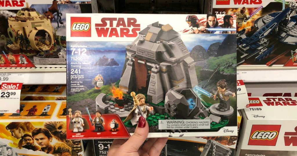 person holding a Lego Star Wars Set 