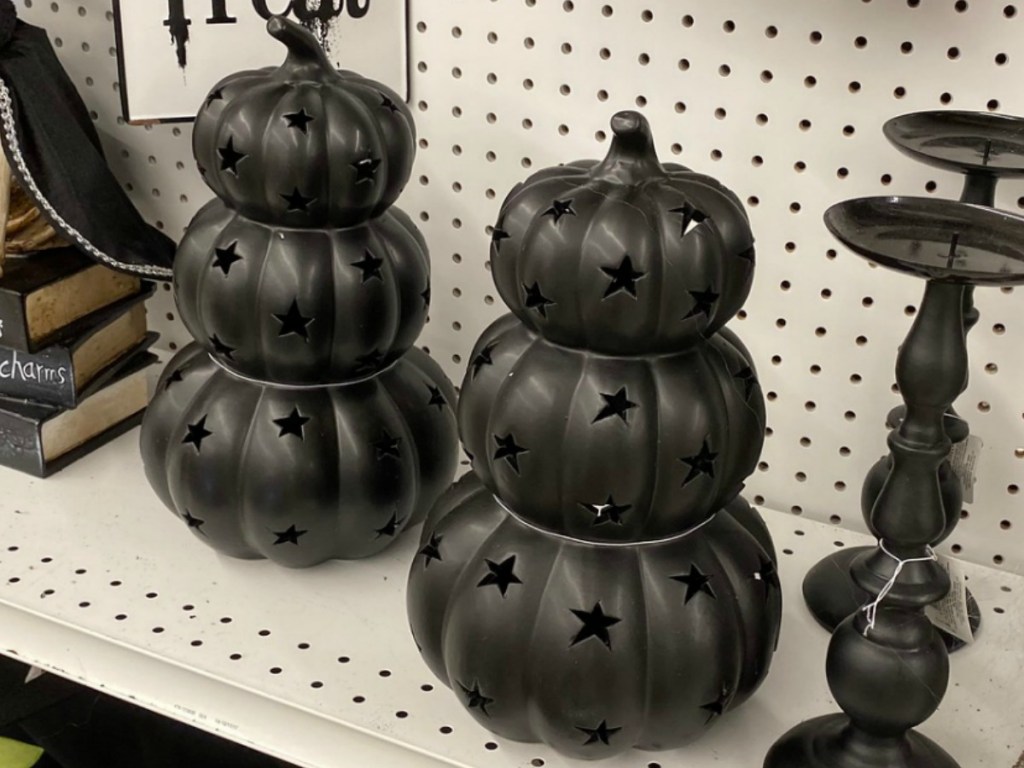 Black Halloween Decoration triple pumpkins stacked on shelf in store