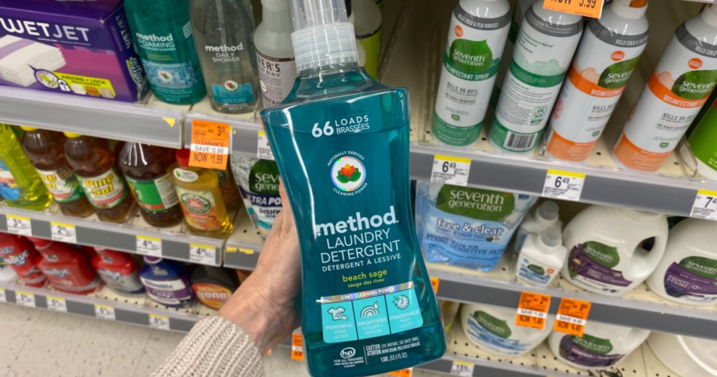 hand holding up bottle of method laundry detergent at walgreens