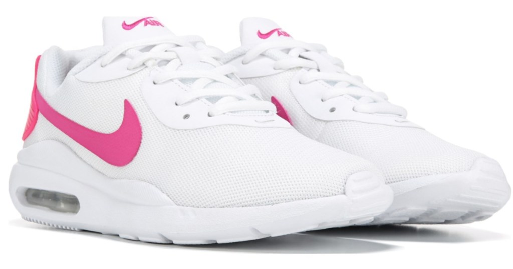 pair of pink and white nike womens sneakers