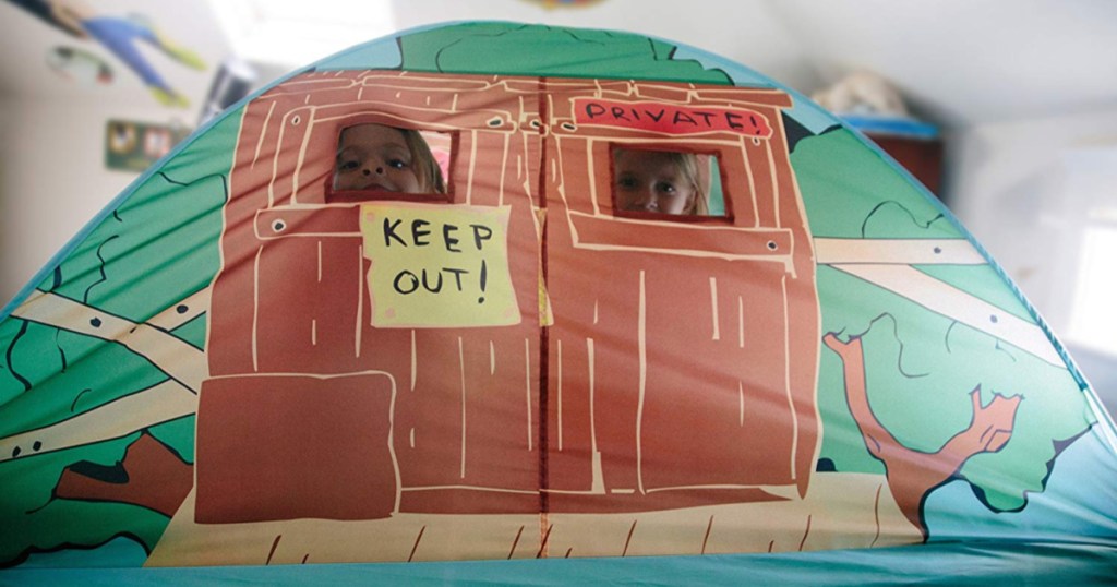 play tent with girls looking out the windows