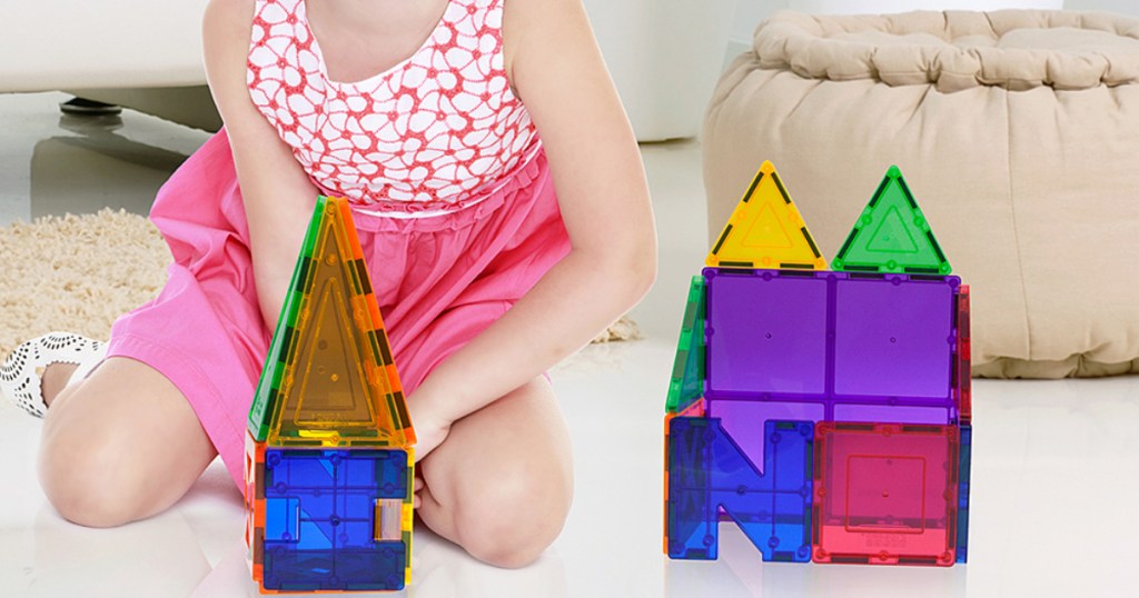 girl playing with picasso tiles set