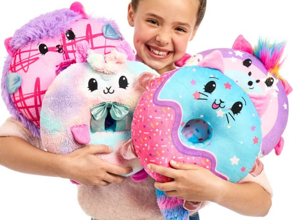 Girl holding Pikmi Pops Doughmi Plush Toy Collection