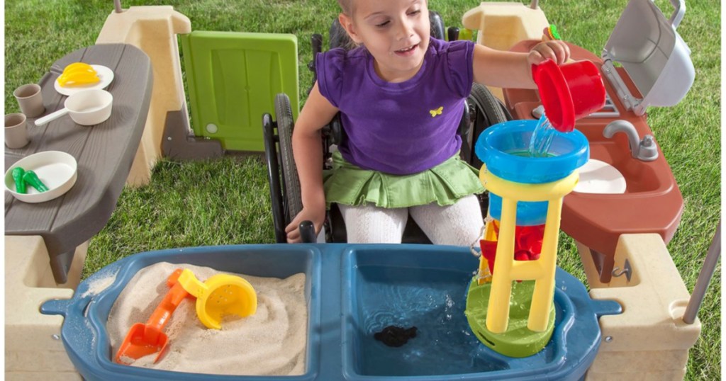 girl playing with step2 patio playhouse