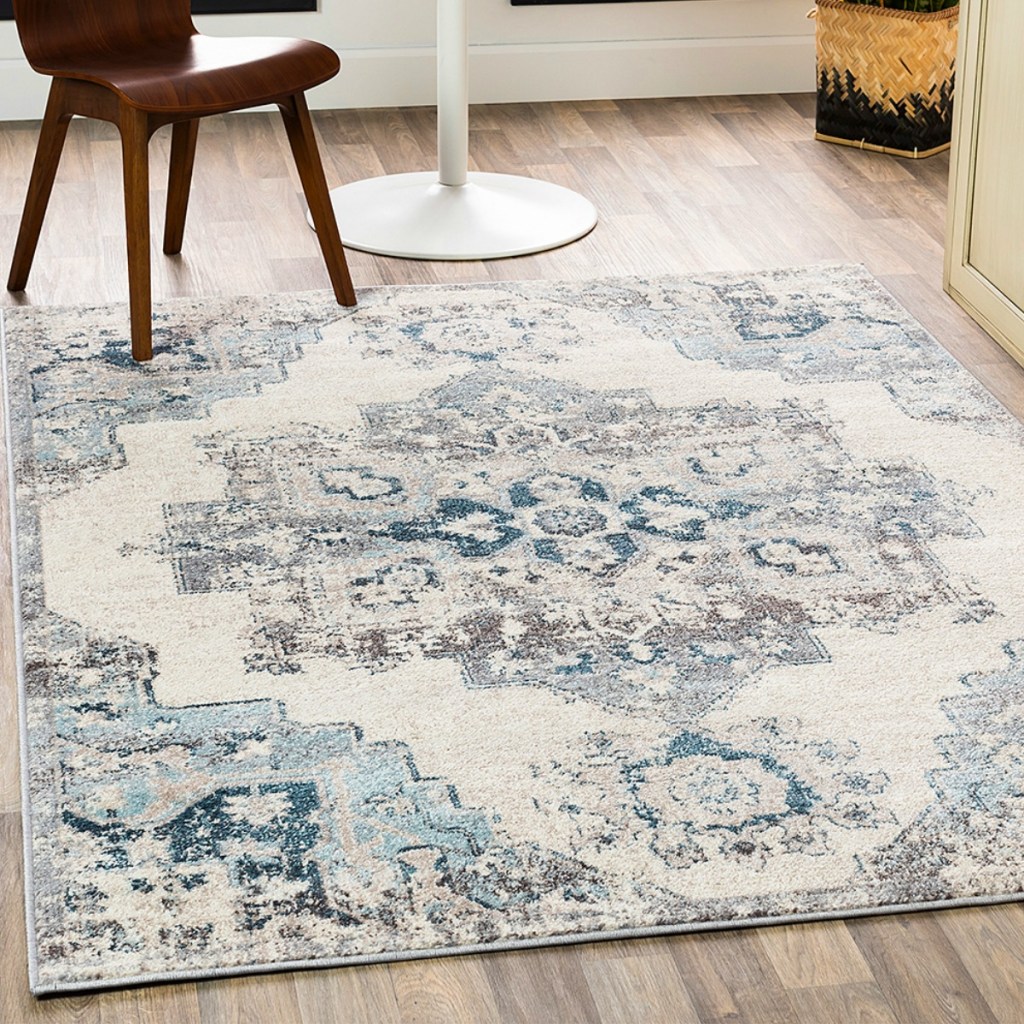 Zulily Area Rug in Teal on light hardwood flooring