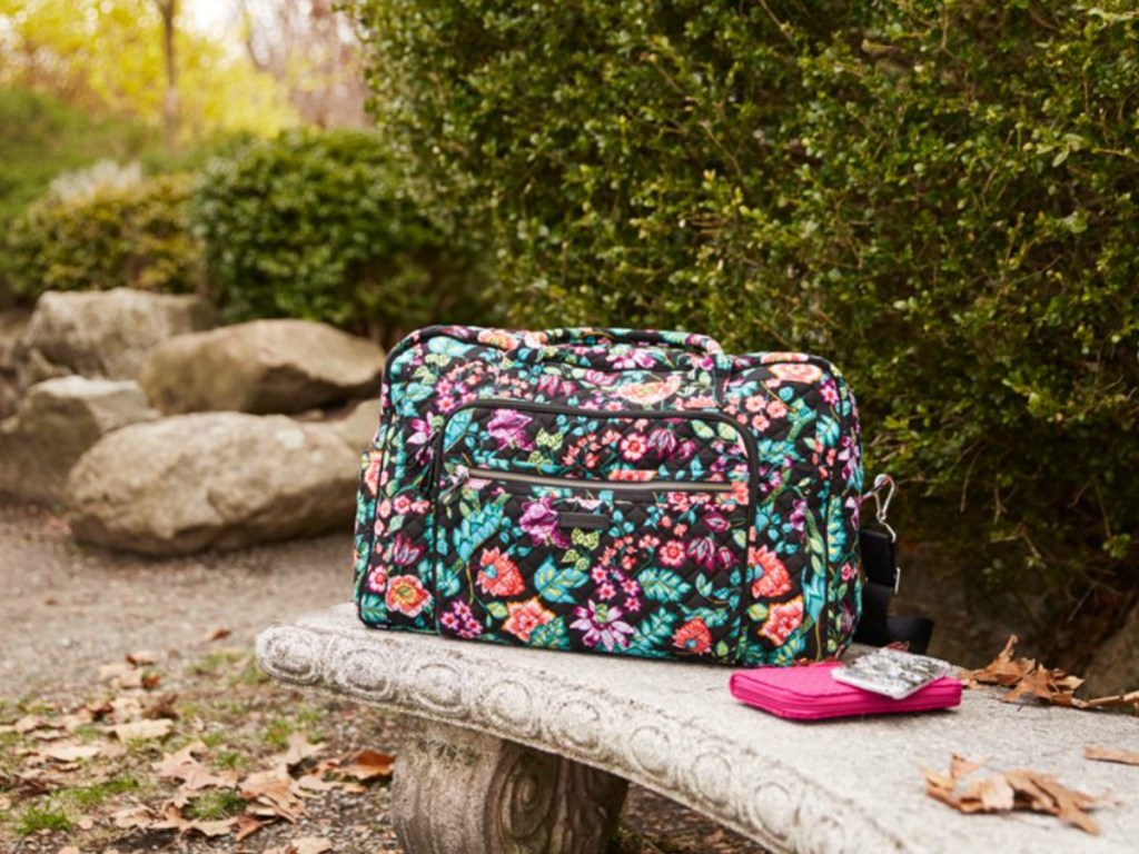 Vera Bradley Weekender on outdoor bench