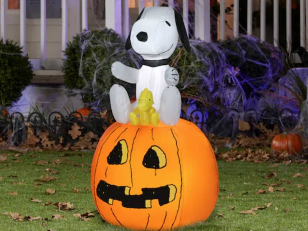 big airblown snoopy and pumpkin on grass