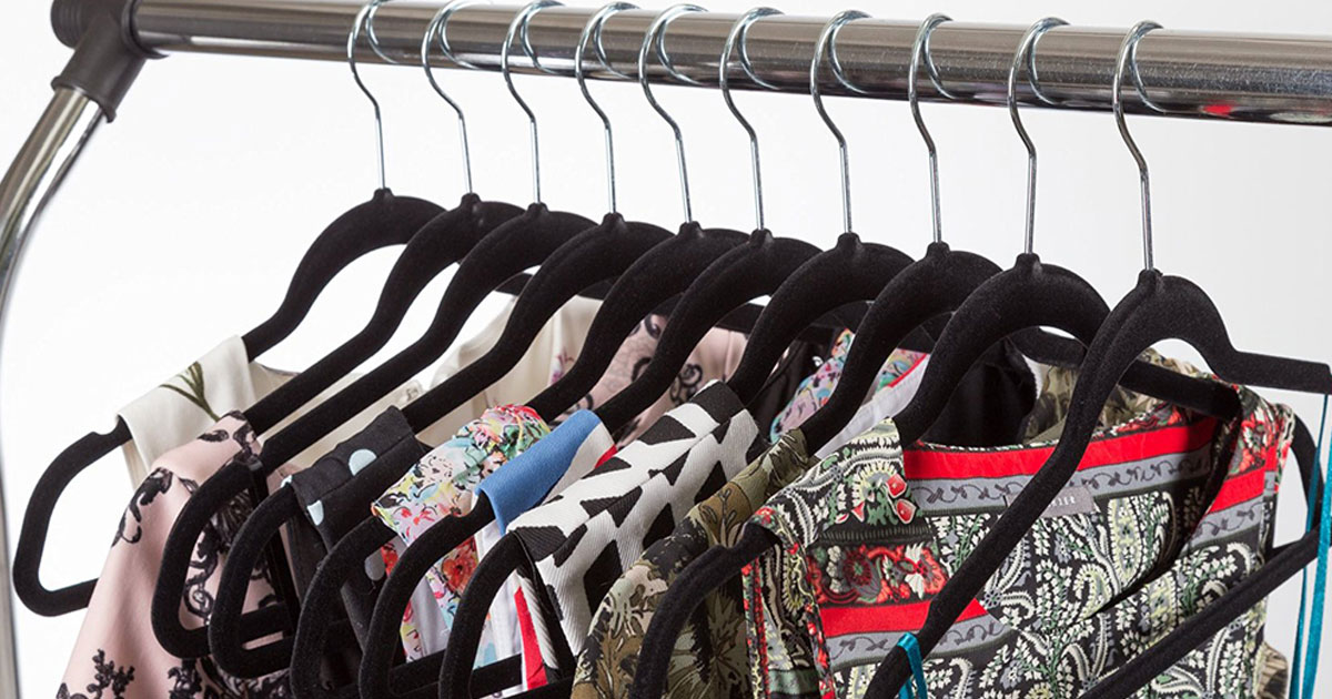 women's clothing hung on a rack with black velvet hangers from zulily