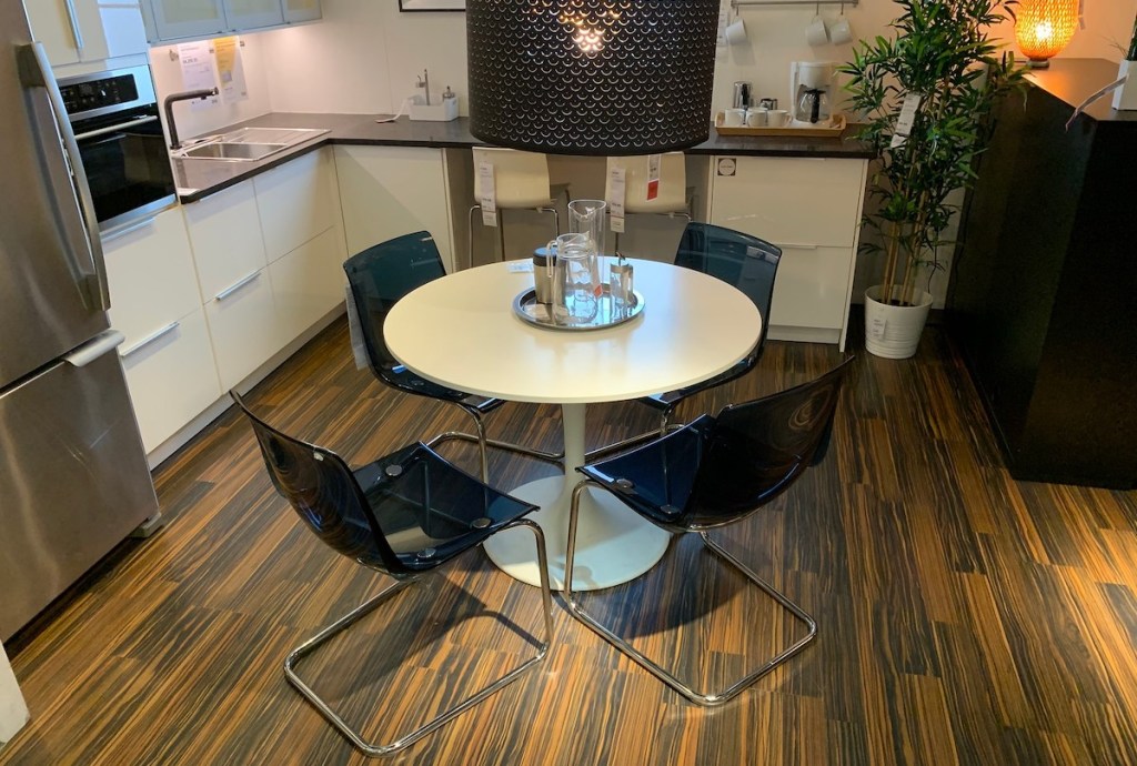 blue acrylic clear chairs in kitchen with white dining room table