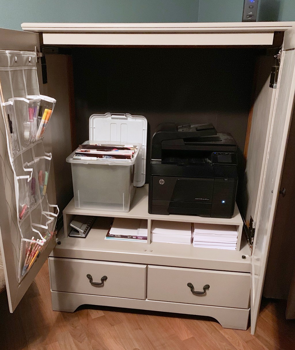 Finished wardrobe cabinet with printer and school supplies